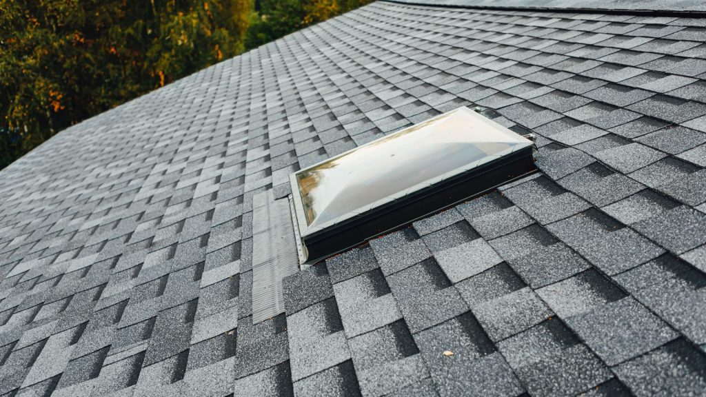 Skylight set into a gray shingle roof