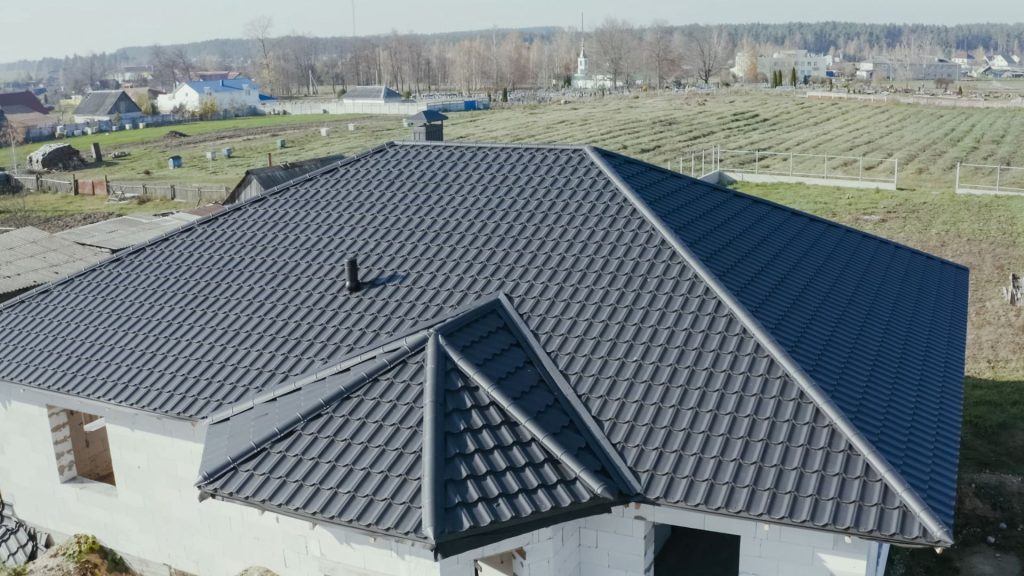 Home with a dark metal hip roof