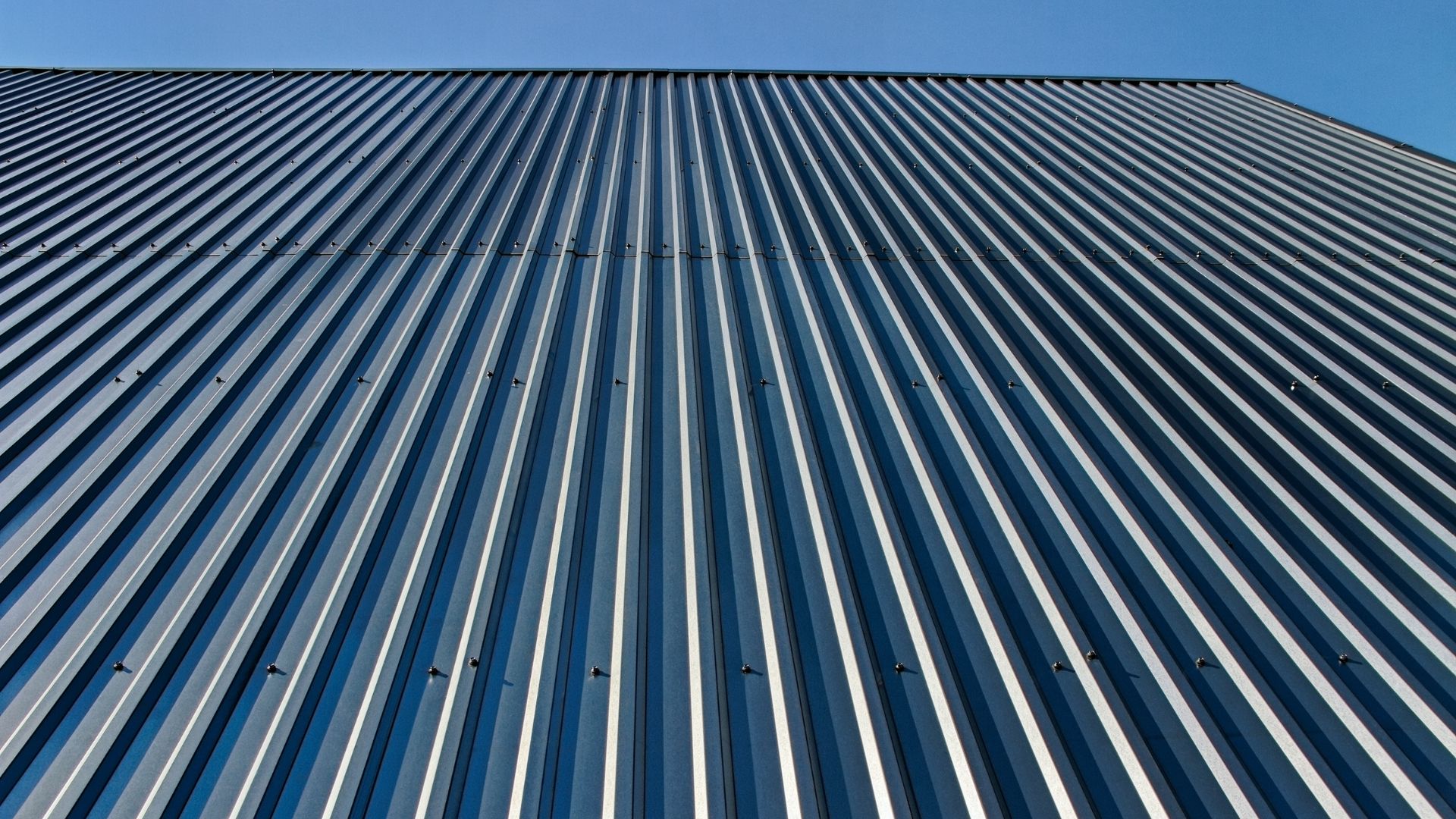 Close view of a dark corrugated metal roof
