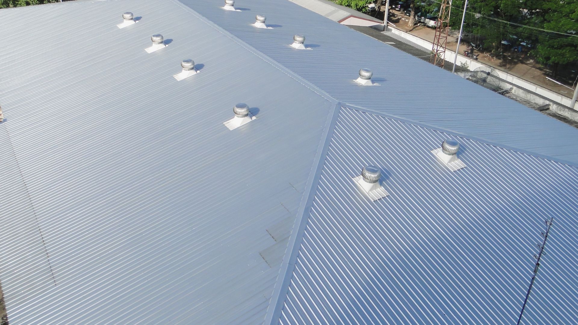 Pale metal roof with rooflights