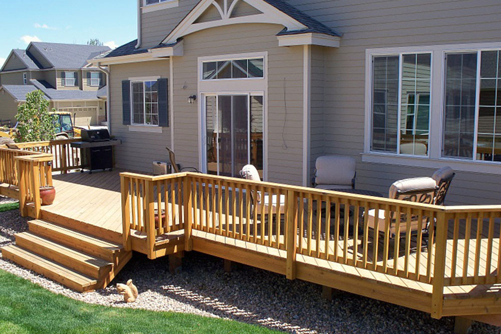 Timber deck with railings and steps at the back of a home