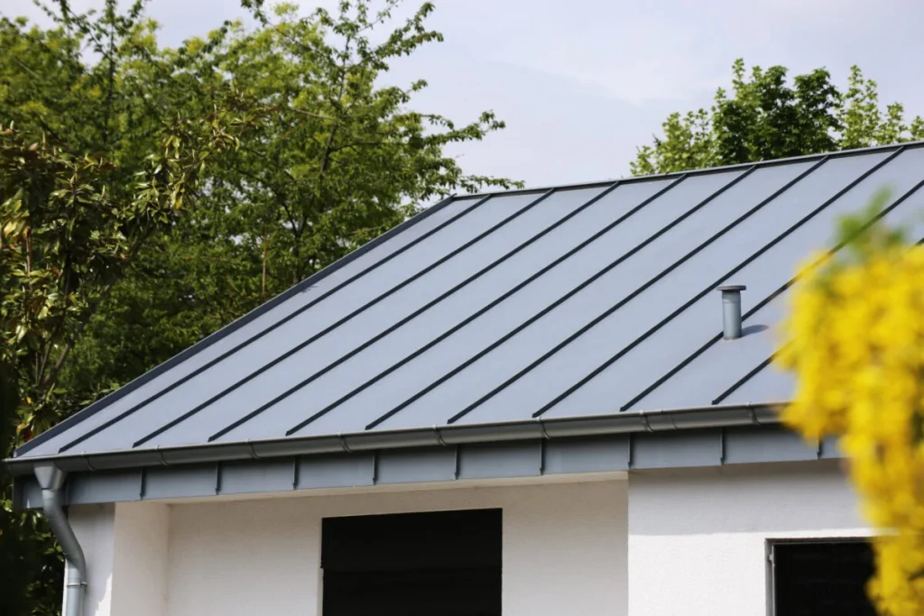 Dark standing seam metal roof on a modern building