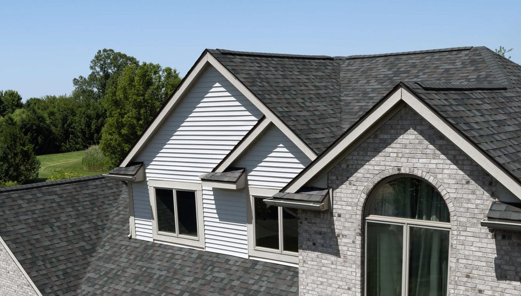 Gray shingle roof with dormer windows