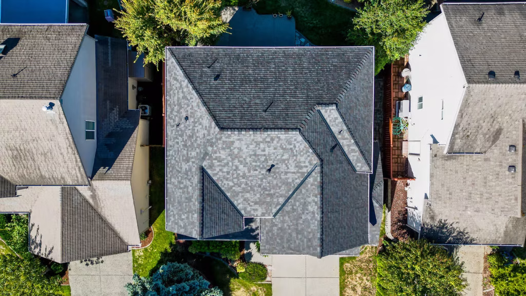 Aerial view of homes with gray shingle roofs