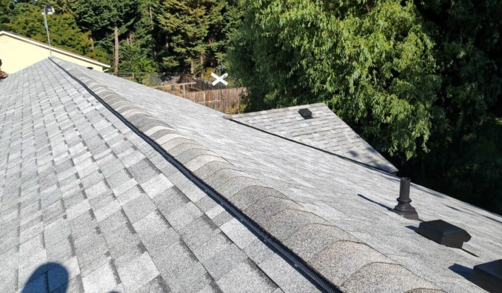 Ridge line of a gray shingle roof