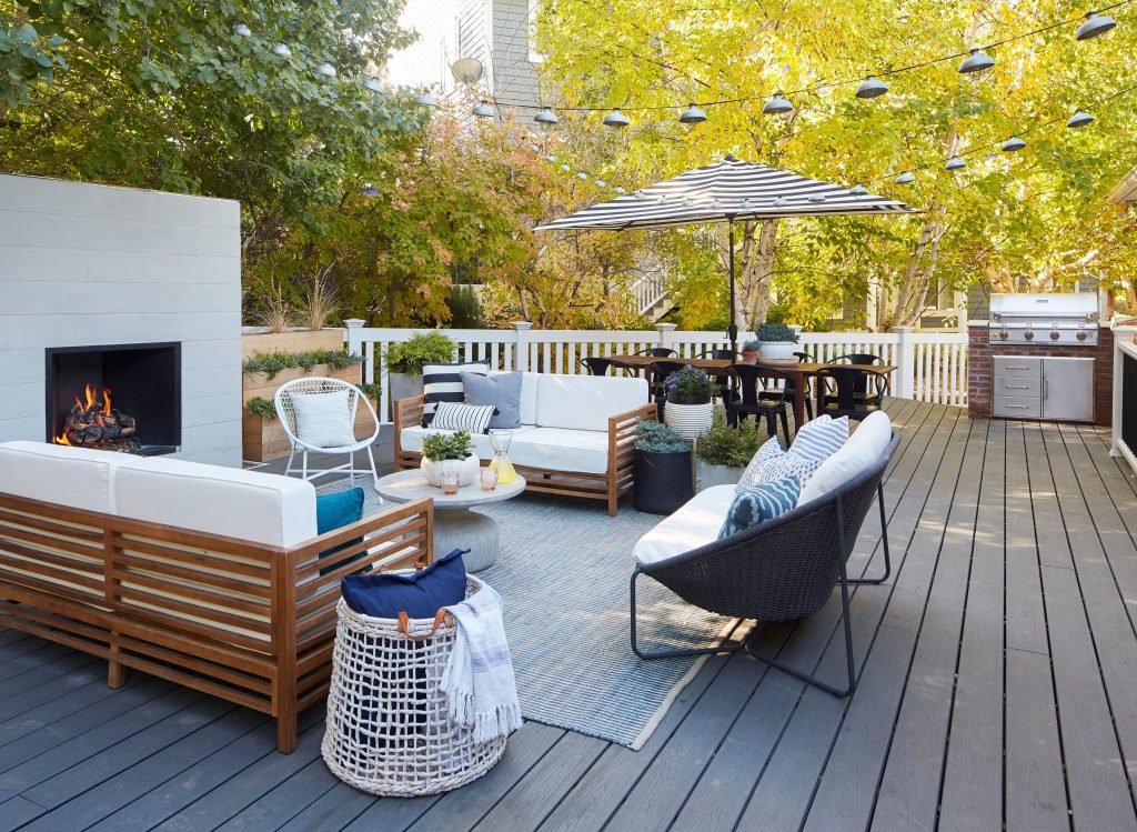 Composite deck with an outdoor fireplace and seating