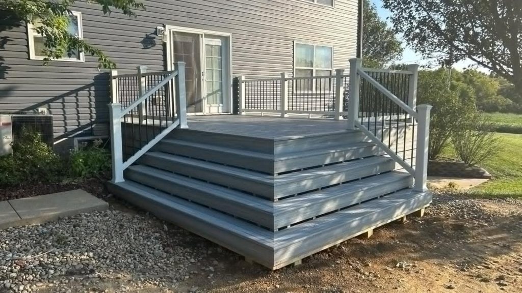 Gray composite deck with steps and railings